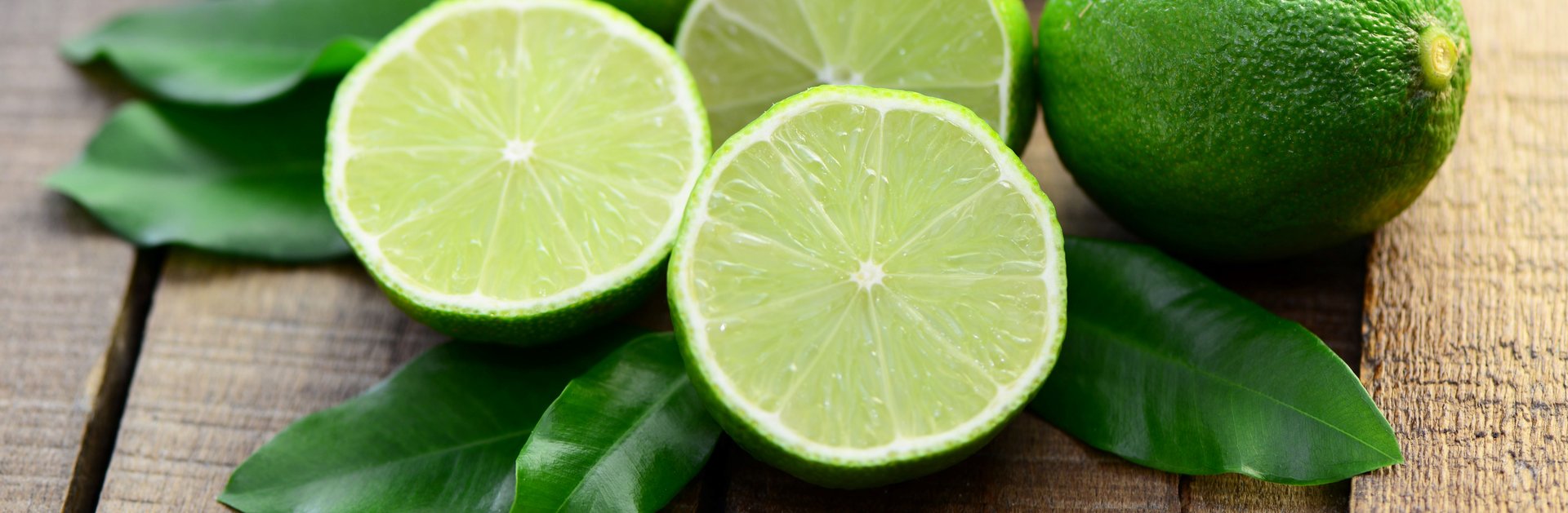 Fresh limes Fresh limes lie on a table